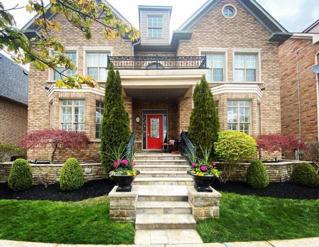 Front yard of beautifully landscaped house in Stouffville