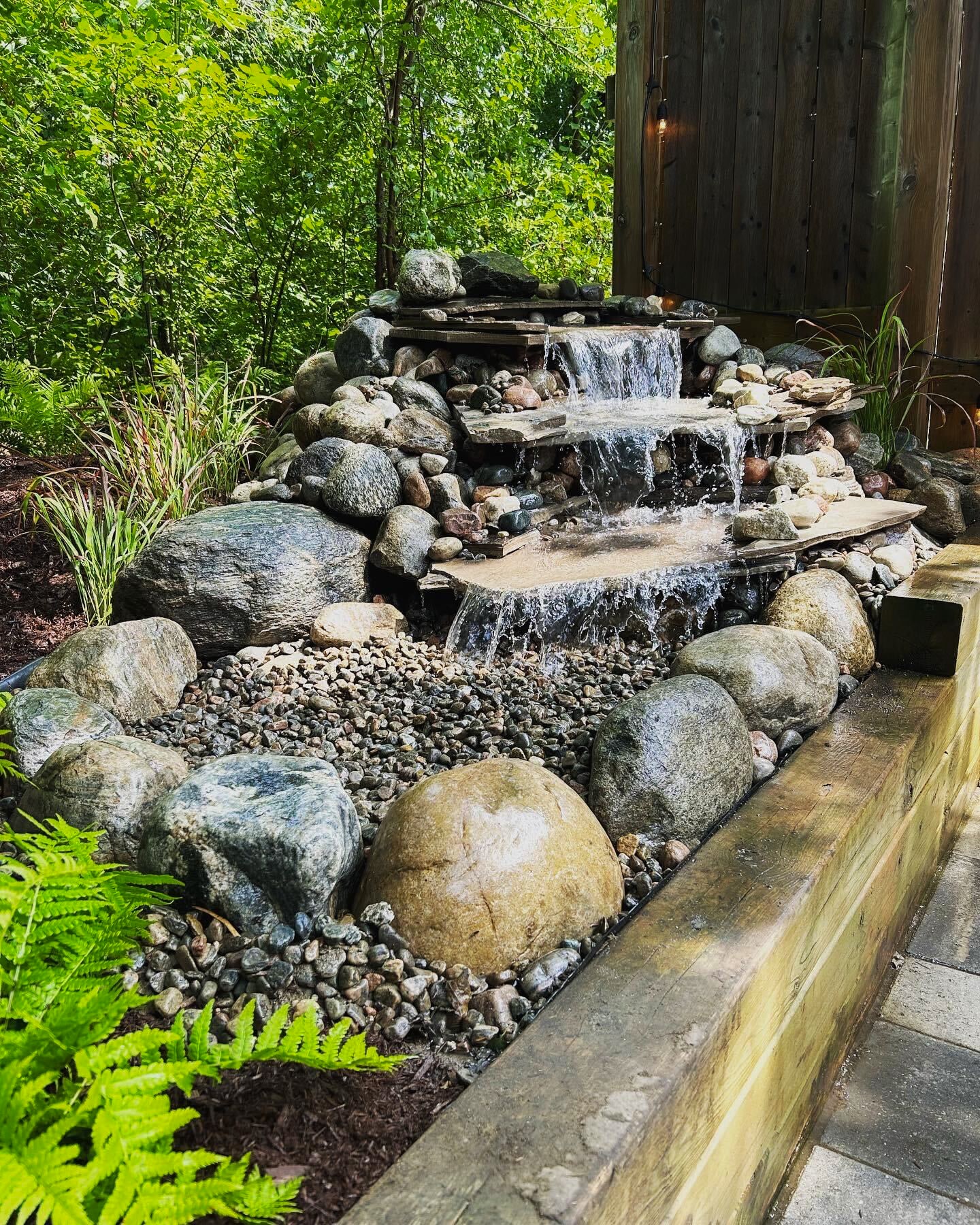 Aquascaped backyard feature by Sunready Landscaping